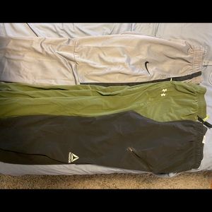 Men’s Workout pants lot! Sizes L-XL. Nike, Under Armour, and Reebok. 3 pairs!
